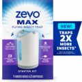 The image shows the packaging for the Zevo Max Flying Insect Trap Starter Kit. The box indicates it includes one corded device and two cartridges. The label highlights that it captures house flies, fruit flies, and gnats without vinegar, and traps twice as many insects.